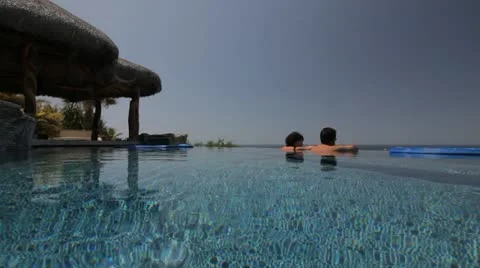 COUPLE IN INFINITY POOL 2 Stock Footage 11128103
