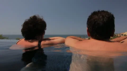 COUPLE IN INFINITY POOL Stock-Footage 11127969