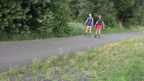 Couple inline skating Stock Footage 157314444