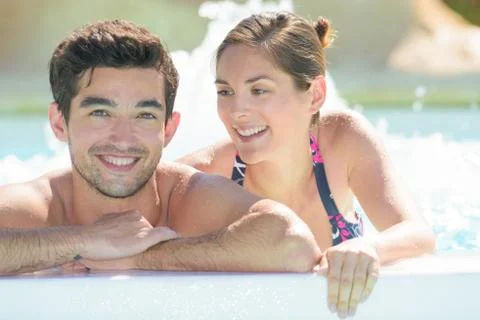 Couple inside the jacuzzi pool Stock Photos