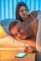 The couple with an insomnia lay on the bed. Evening night time Photo