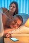 The couple with an insomnia lie on the bed. Evening night time Photo