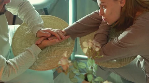 Couple intertwining hands, expressing deep emotional bond while offering wo.. Stock Footage 304053468