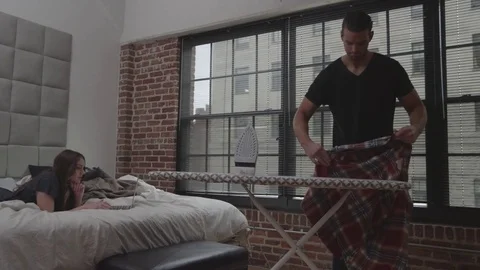 Couple Ironing Clothes Stock Footage 70808201