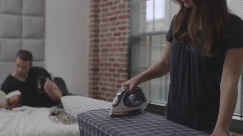 Couple Ironing Clothes Stock Footage 70808321