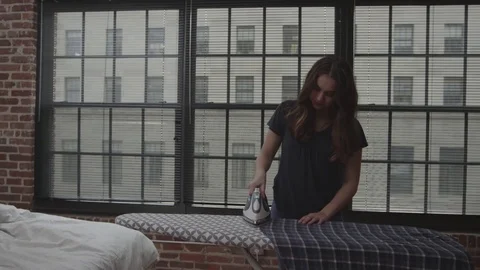 Couple Ironing Clothes Stock Footage 70808422