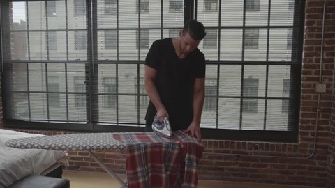 Couple Ironing Clothes Stock Footage 70808475