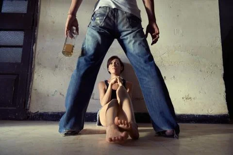 Couple issues with angry drunk man and scared wife Stock Photos