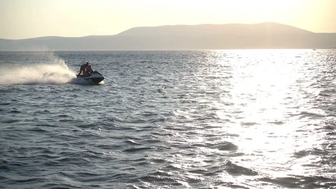 A Couple On a Jet Ski Stock Footage 86493735