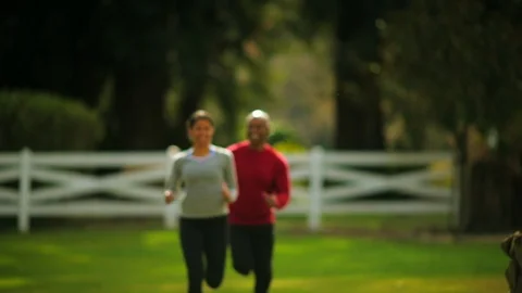 Couple jogging and smiling. 스톡 동영상 88406197