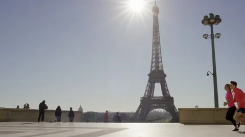 Couple Jogging with the eiffel tower in the background. Video stock 63023181