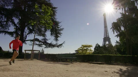 Couple Jogging with the eiffel tower in the background. Stock Footage 63024411