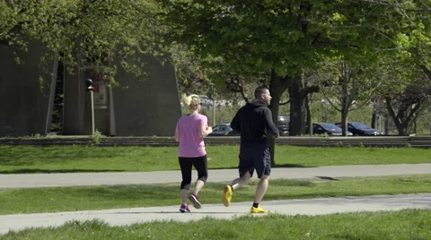 A couple jogging in the park. 4K UHD. Stock Footage 50562001