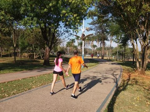 Couple jogging at the park Stock Photos