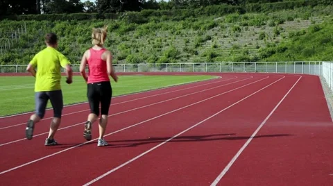 Couple jogging stadium Stock Footage 11127840