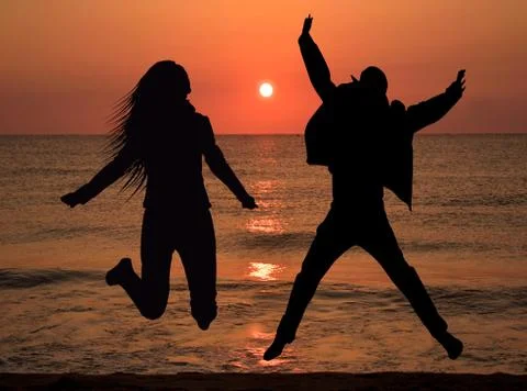 Couple jumping in the air Ilustração Stock