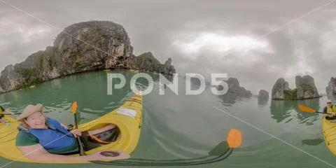 Couple kayaking in Ha Long Bay Vietnam Stock Photos