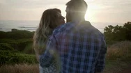 Couple Kiss While Enjoying The Sunset Stock Footage