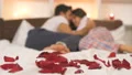 The couple kissing on the bed with a gift box 4k or 4k+ Resolution
