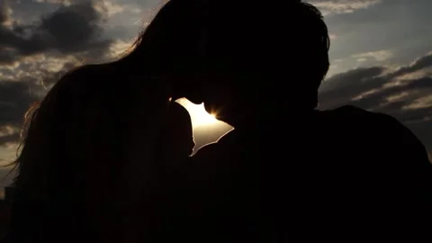 Couple kissing during dawn Stock Footage 259851253