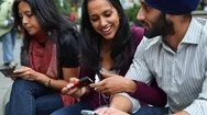Couple Kissing At Fountain While Friend Is Texting On Cell Phone Stock Footage