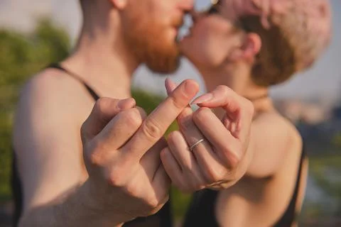 Couple kissing, gesturing fuck off Stock Photos