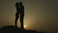 Couple kissing tenderly at romantic date outdoors. Man and woman in love hugging HD Footage