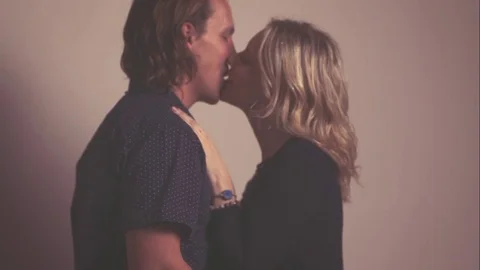 Couple Kissing While Confetti is Falling in Slow Motion Stock Footage 75942314