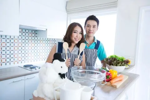 Couple in kitchen Stock Photos