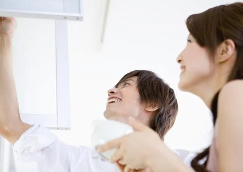 Couple in kitchen Stock Photos
