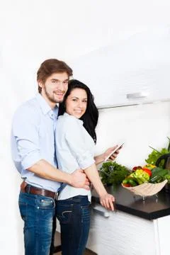 Couple at kitchen Stock Photos