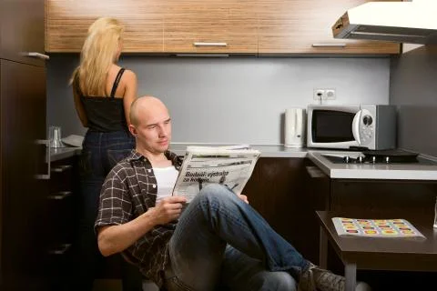 Couple in kitchen Stock Photos