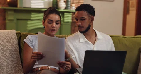 Couple, laptop and document for mortgage, expenses and financial planning or Stock Footage 308644430