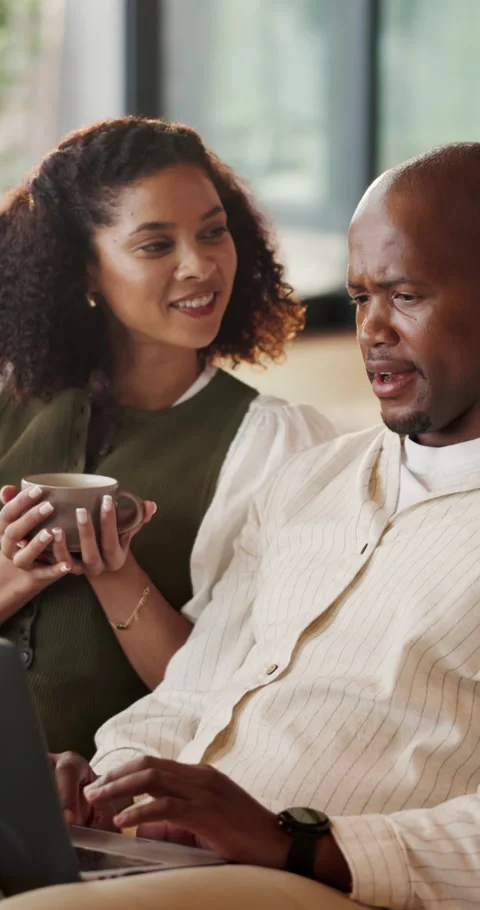 Couple, laptop and support with talk on sofa for startup proposal, venture Stock Footage 337029425