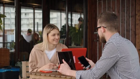Couple with laptops having coffee. Stock Footage 109576380