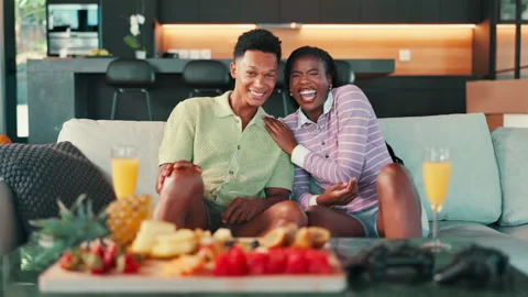 Couple, laughing and watching tv with Stock Video Pond5