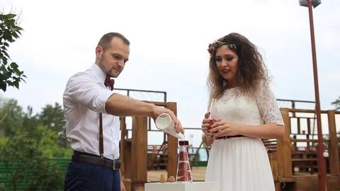 Couple laughing on the background of the wedding decorations. Stock Footage 69889248