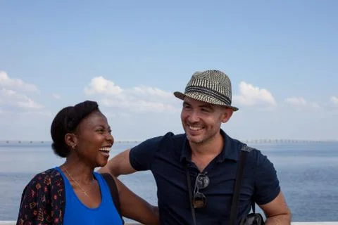 Couple Laughing Together on a Waterfront. Foto stock