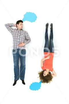 The couple lay near the dialog signs. View from above Stock Photos