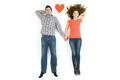 The couple lay near the heart sign. View from above Photo