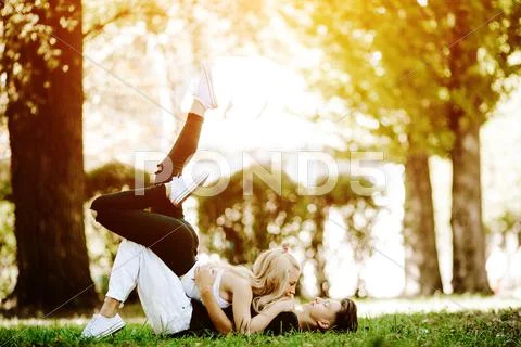Couple laying on the grass Stock Photos