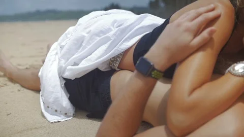 Couple Laying on the Sand 3 Stock Footage 90545682