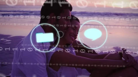 Couple leaning on beach binary stream causing overlaying app icons then receding Video stock 333575239