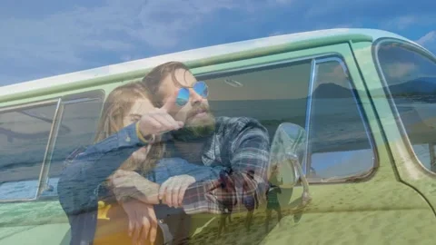 Couple leaning from green van window, woman pointing, beach travel overlay Stock Footage 332280756