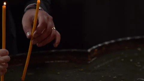 The couple is lighting a candle 스톡 동영상 329887946