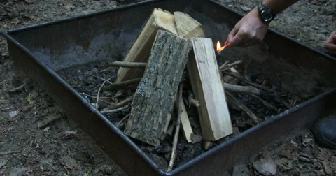 Couple lighting fire on camp site Video stock 39299454