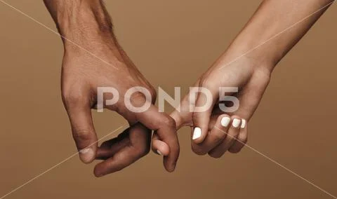 Couple linking index fingers Stock Photos