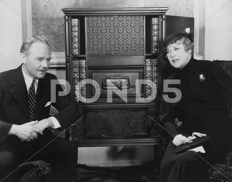 Couple listening to radio Stock Photos