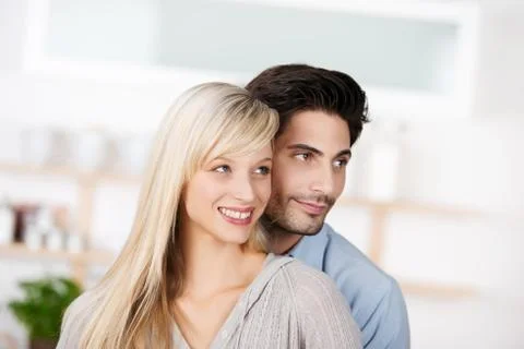Couple looking away in kitchen Stock Photos