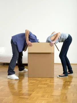 Couple looking in box Stock Photos